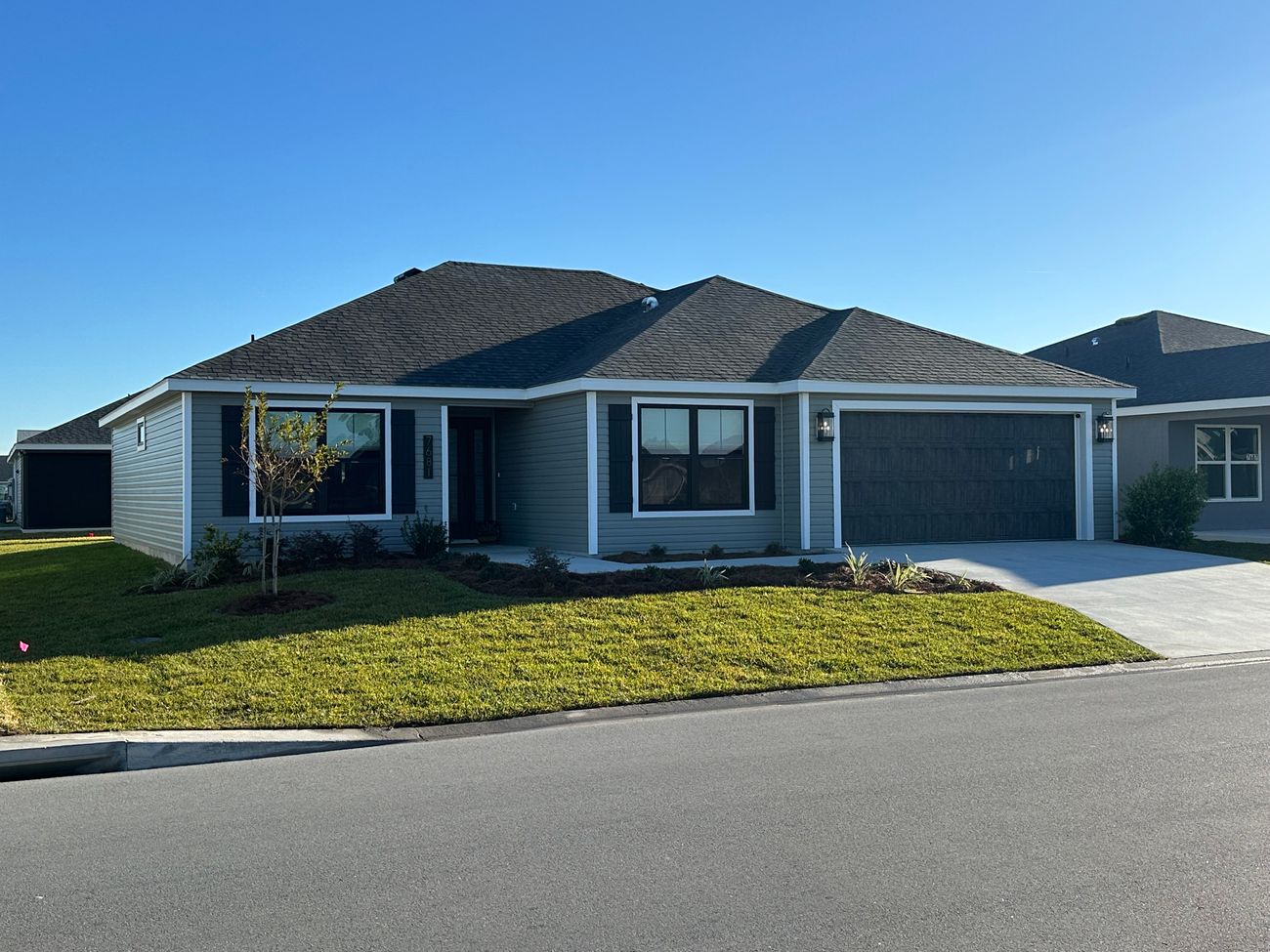 Shady Brook home exterior with blue sky